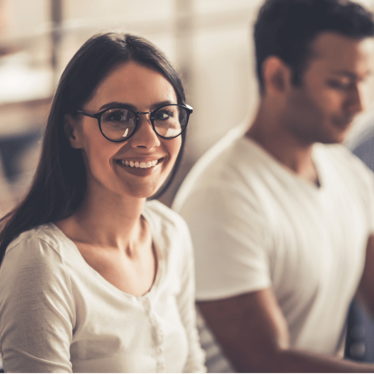 Woman smiling in an office.